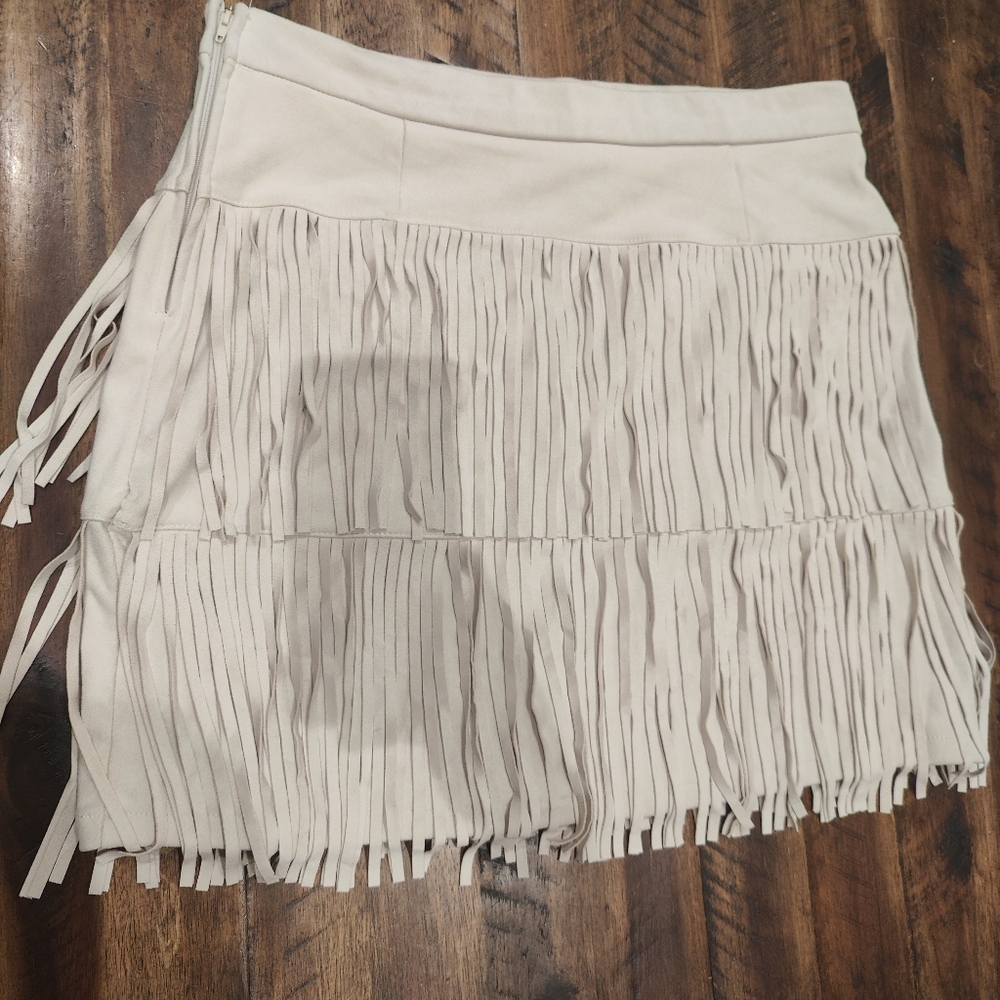 Beige fringe skirt.